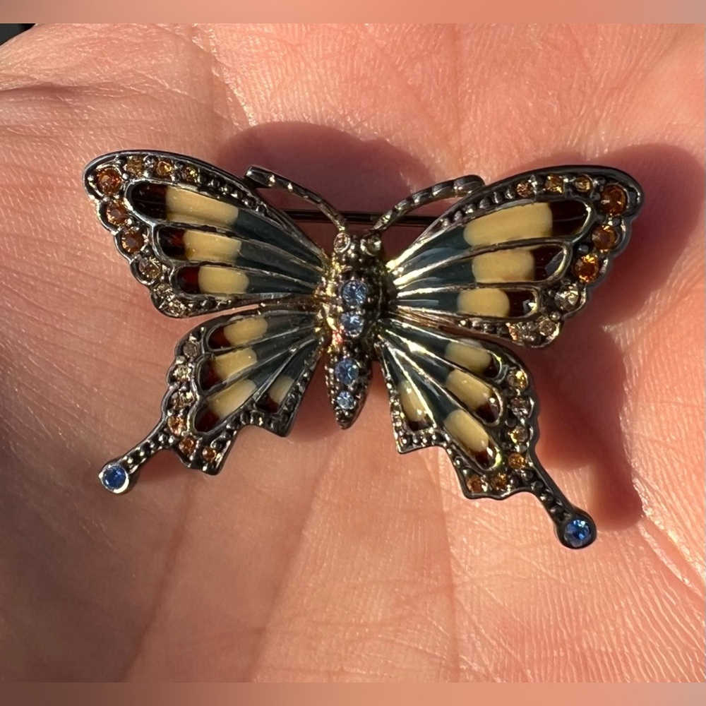 Vintage Monet Butterfly brooch with colorful crystals on wings.